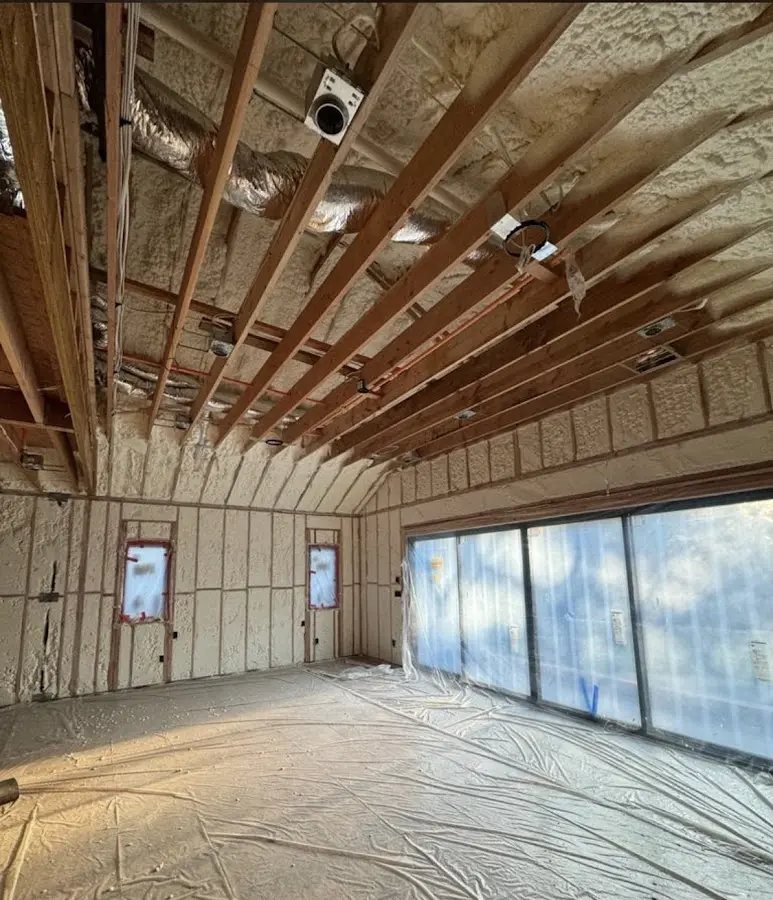 Interior walls and ceiling insulated with spray foam during new construction in Plainfield